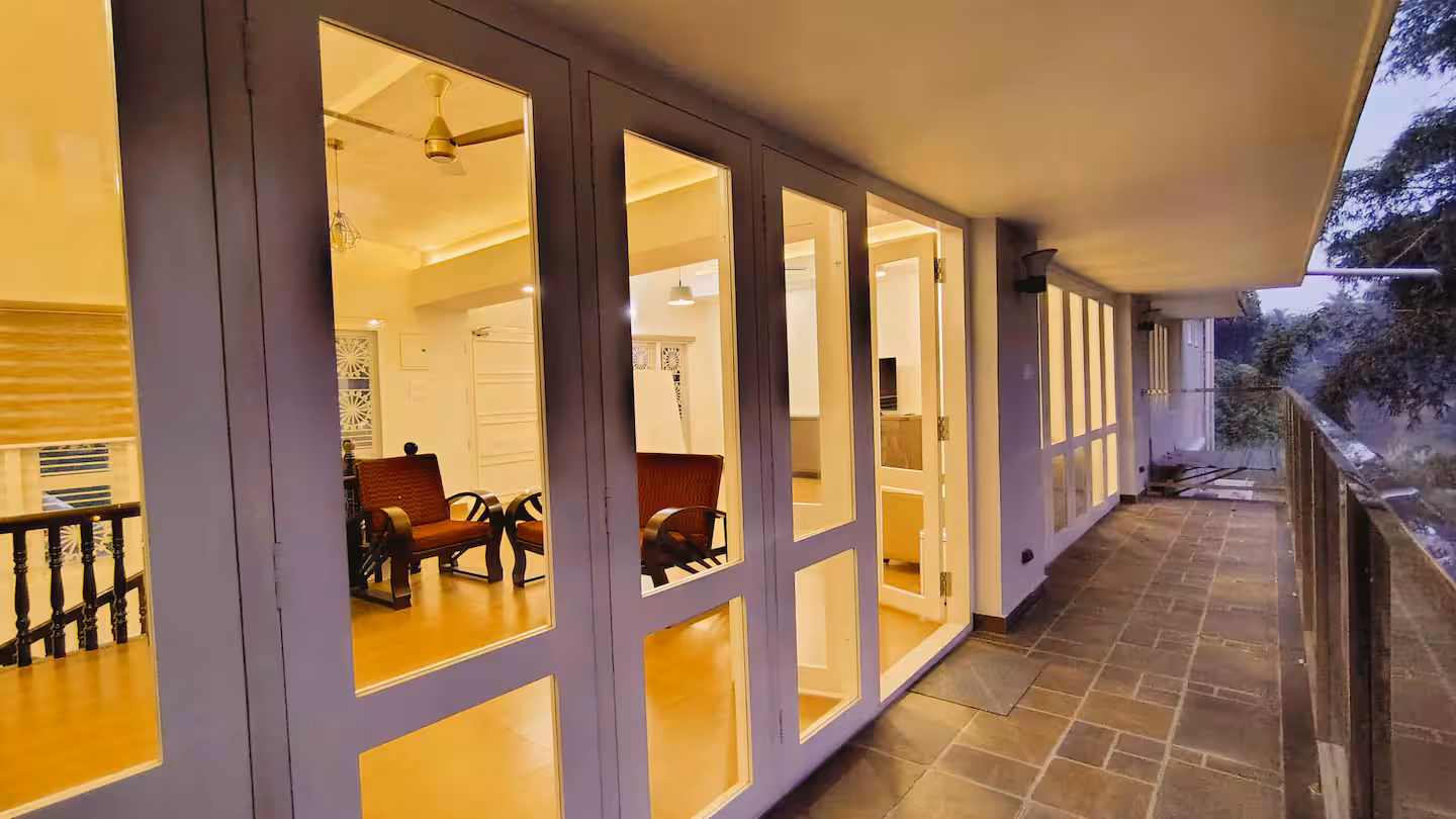 First-floor balcony offering a panoramic view of the Manimala River